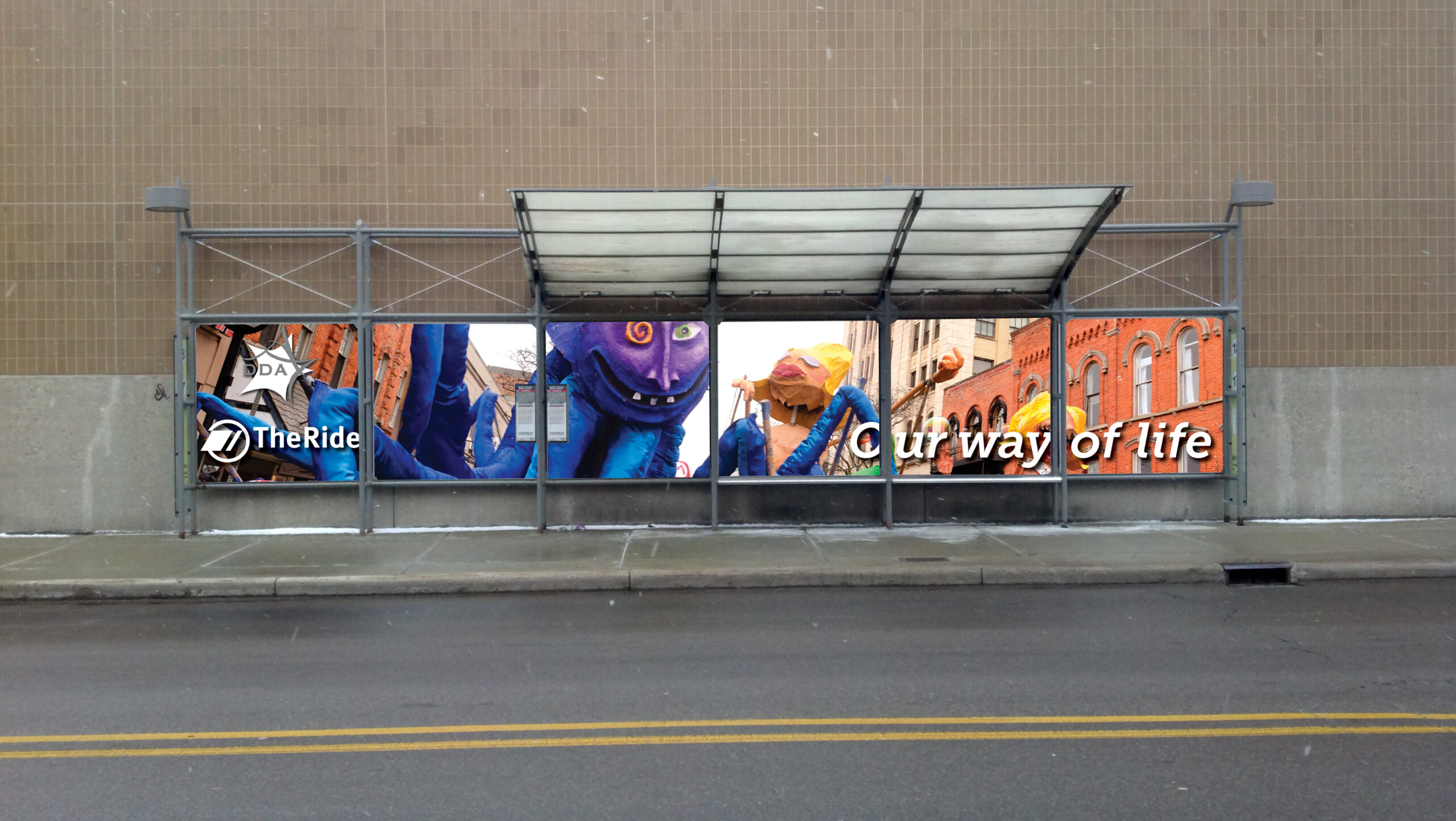 A bus shelter with fully printed artwork along the back showcasing an annual local parade.