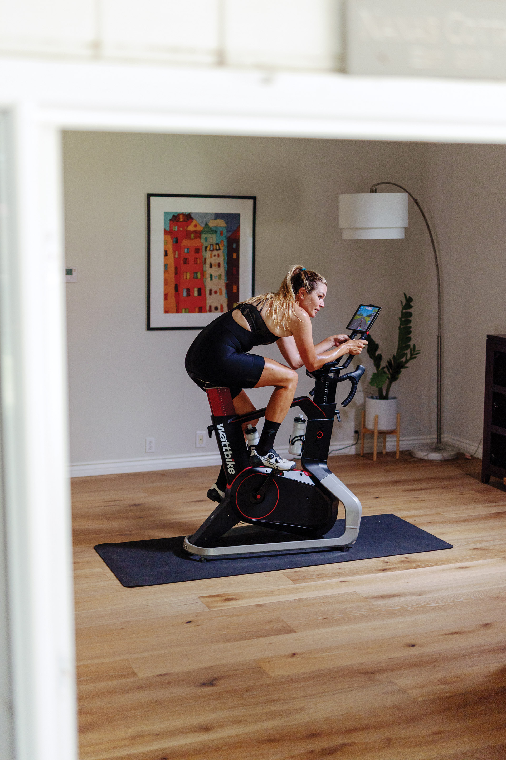 An athlete training on her Wattbike Atom